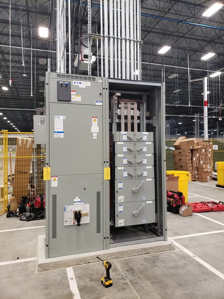 Switchgear cabinet with door open, installed inside a distribution centre